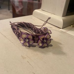 purple adjustable woven bracelet with flowers